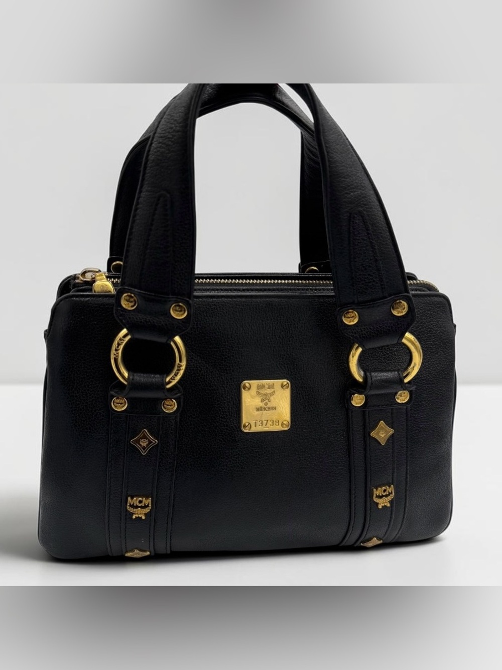 MCM Black Leather Satchel with Gold Hardware Accents
